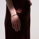 Model wearing the John Hardy 14K gold Heishi black onyx bracelet