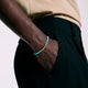 Model wearing the John Hardy 14K gold Heishi turquoise bracelet
