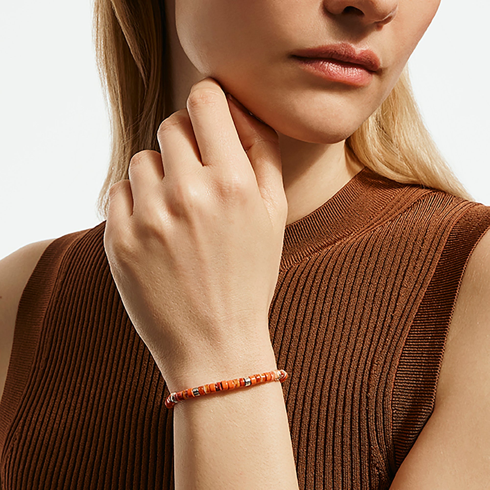 Model wearing the John Hardy Heishi spiny oyster shell bracelet
