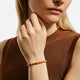 Model wearing the John Hardy Heishi spiny oyster shell bracelet