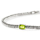 Close-up of the cushion-cut peridot center stone