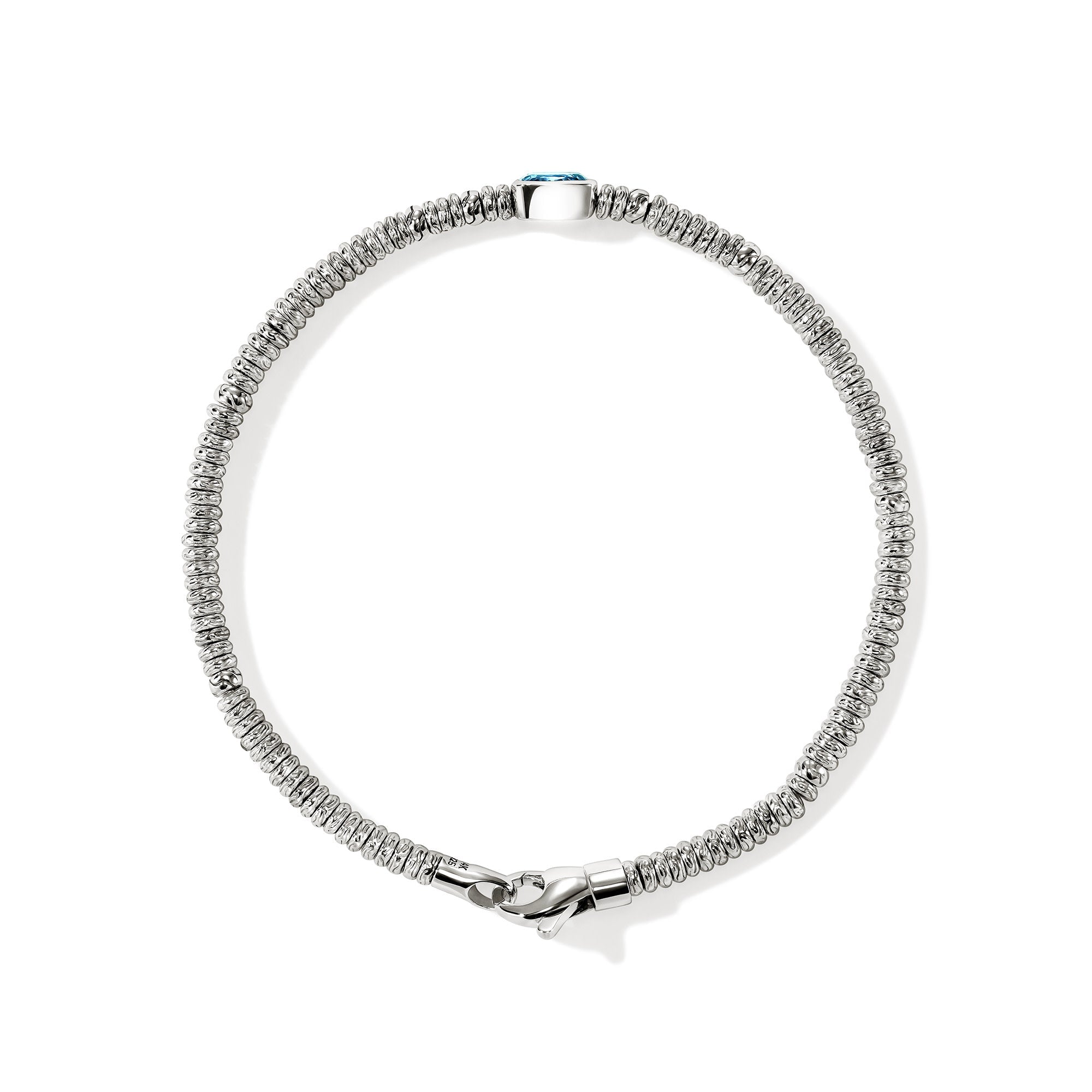 Overhead view of the John Hardy Heishi Swiss blue topaz rondel bracelet
