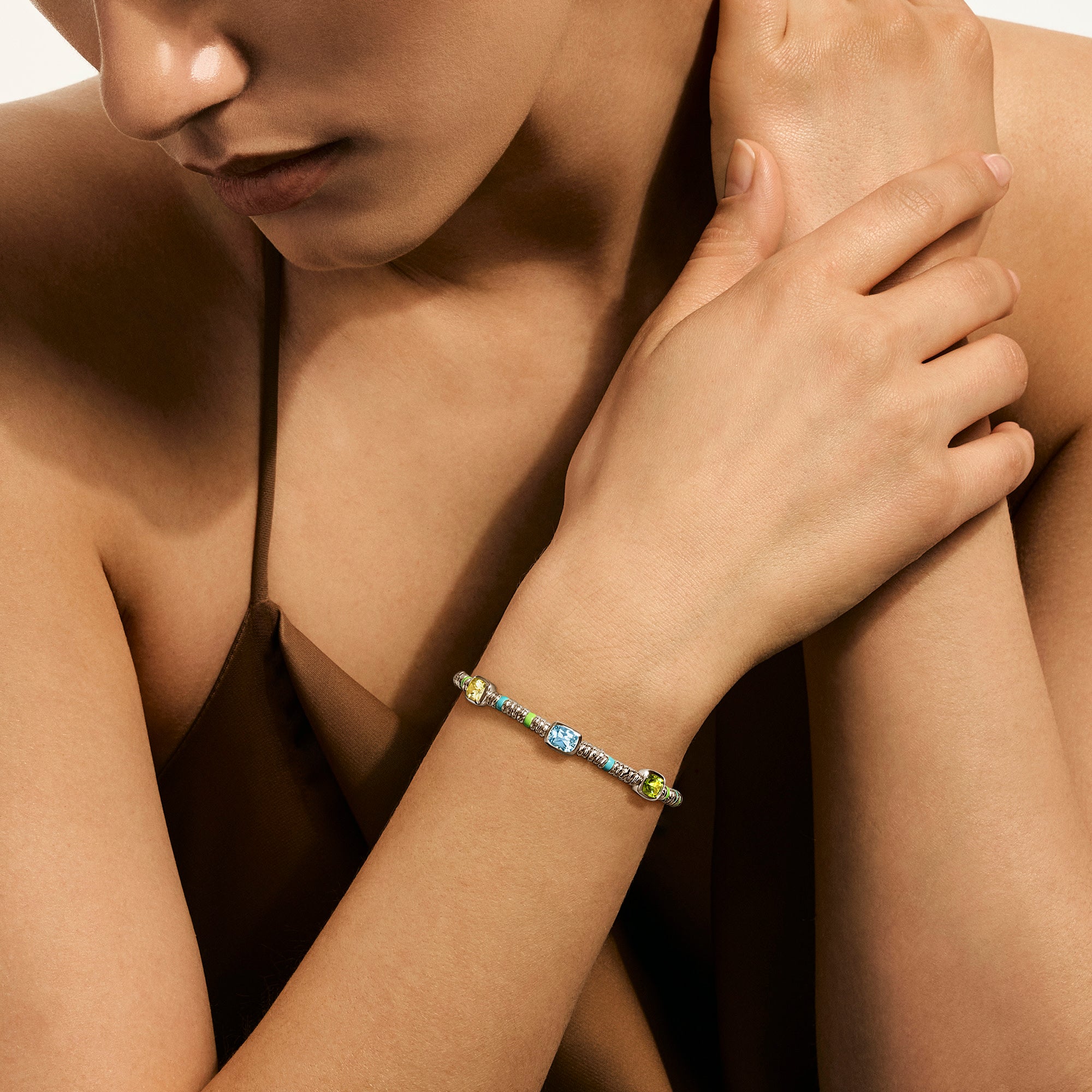 Model wearing the John Hardy Heishi peridot bracelet
