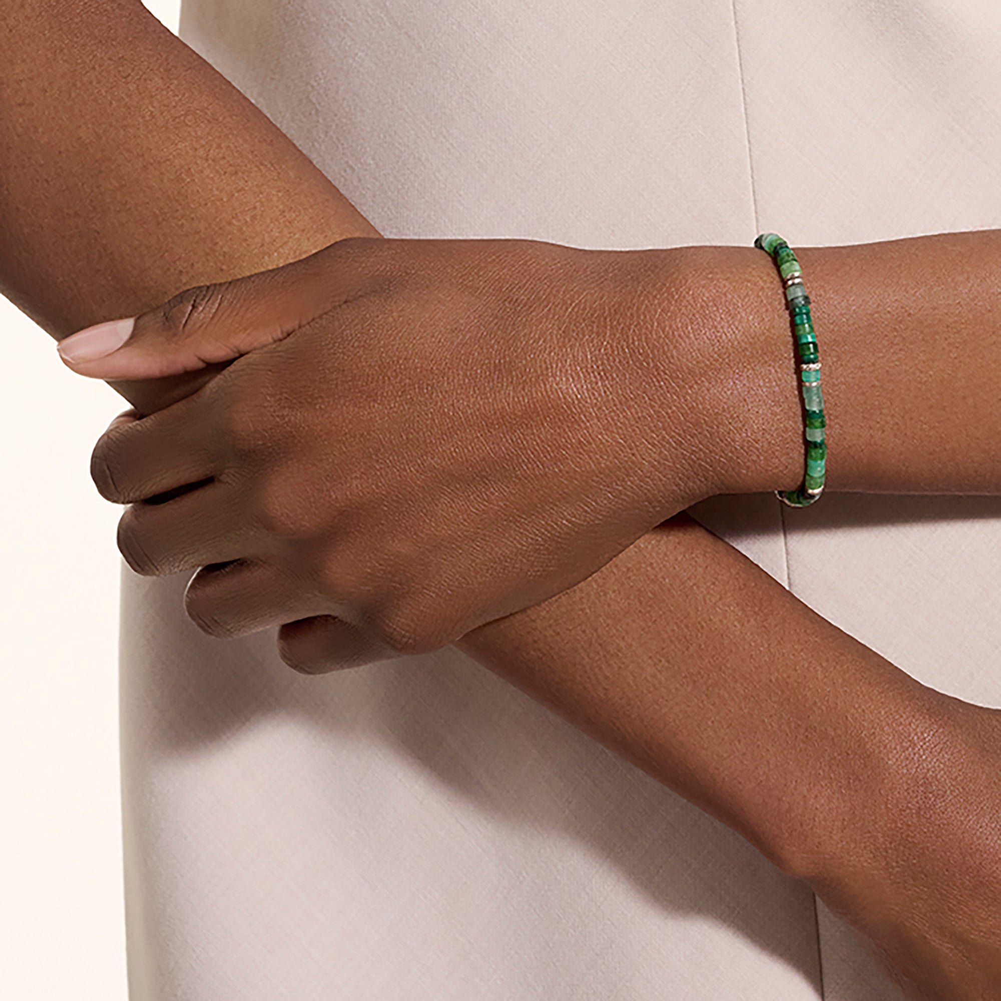 Model wearing the John Hardy Heishi emerald and hardstone bracelet