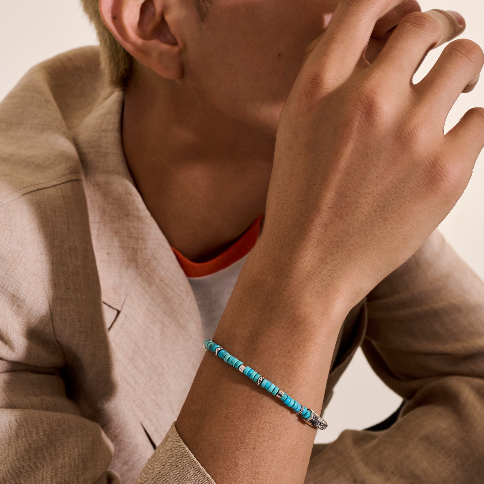 Model wearing the John Hardy Heishi turquoise chain bracelet
