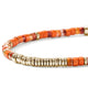 Close-up of spiny oyster shell and orange enamel beads with gold accents