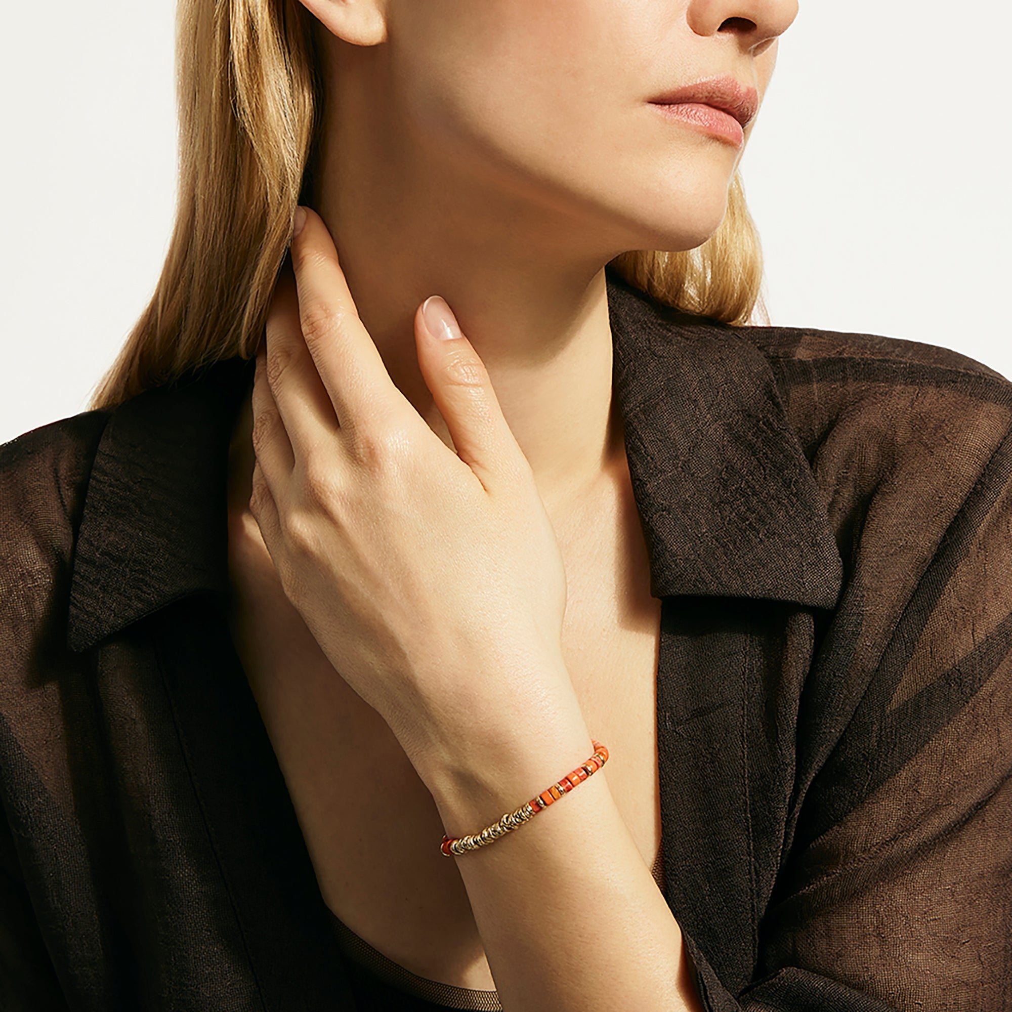 Model wearing the John Hardy Heishi spiny oyster shell bracelet