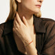 Model wearing the John Hardy Heishi spiny oyster shell bracelet