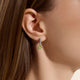 Model wearing the John Hardy Heishi peridot drop earrings
