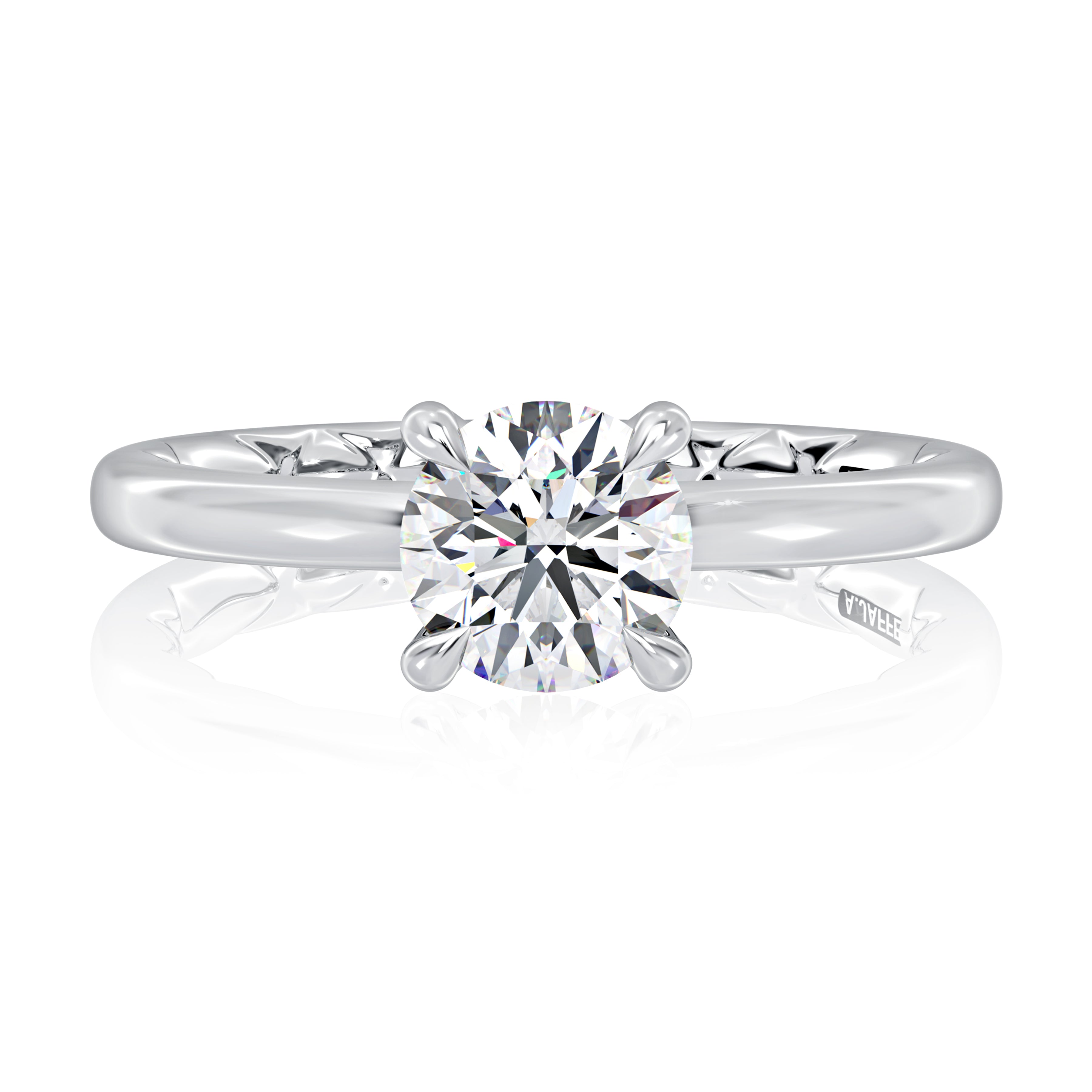 Top view of a 14K white gold four-prong solitaire engagement ring with a round center diamond