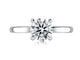 Top view of a 14K white gold four-prong solitaire engagement ring with a round center diamond