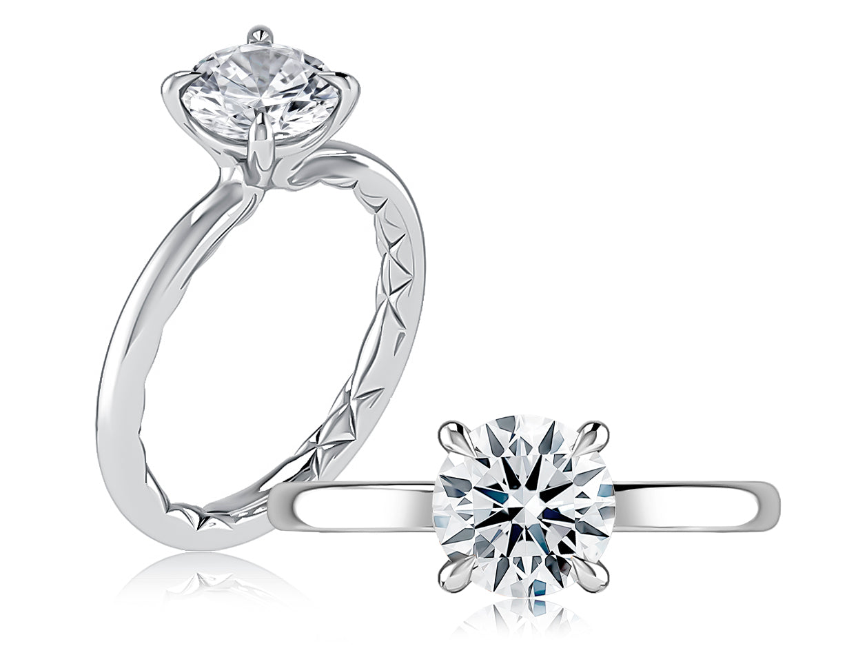 14K white gold four-prong solitaire engagement ring setting with a round center diamond, shown standing and lying flat