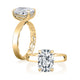 14K yellow gold hidden halo engagement ring setting with an elongated cushion center diamond, shown standing and lying flat