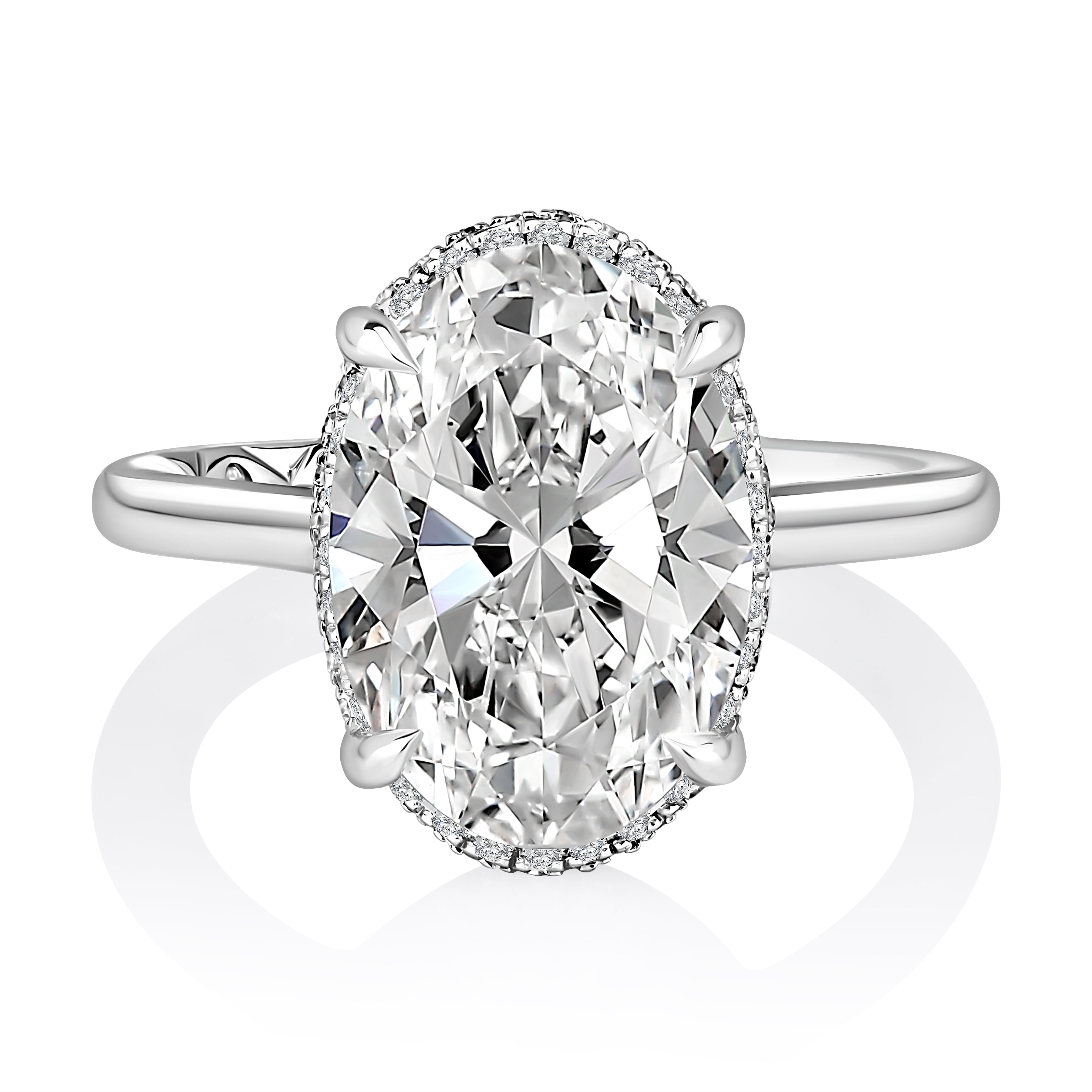 Top view of a 14K white gold halo engagement ring setting with an oval center diamond