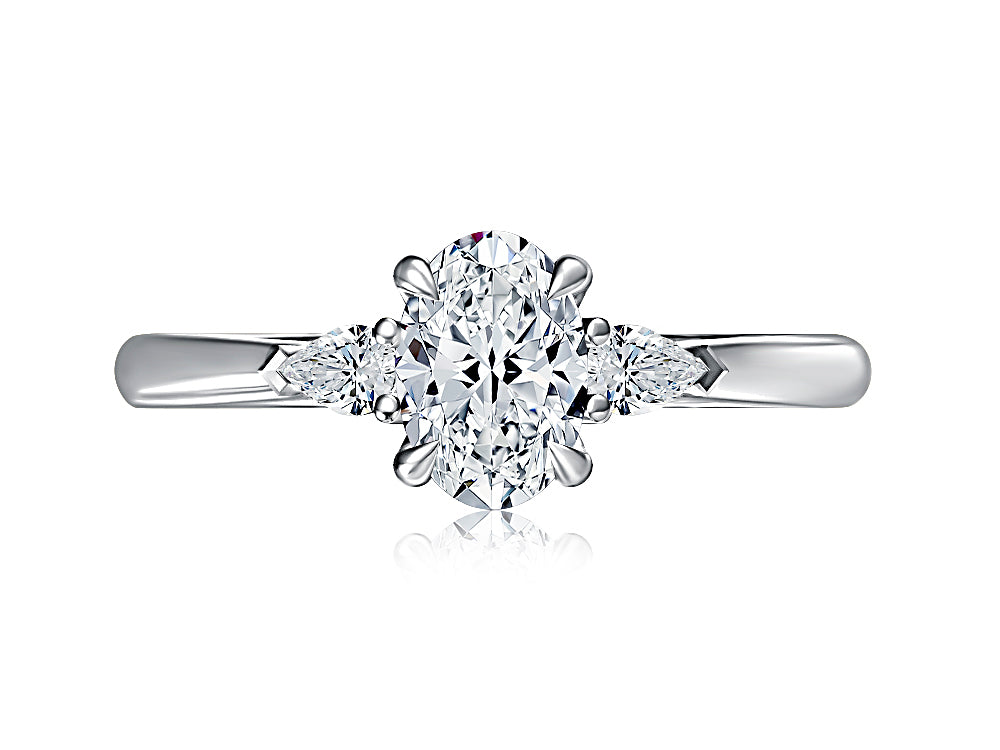 Top view of a 14K white gold three-stone engagement ring with an oval center diamond