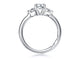 Side view of a 14K white gold three-stone engagement ring setting