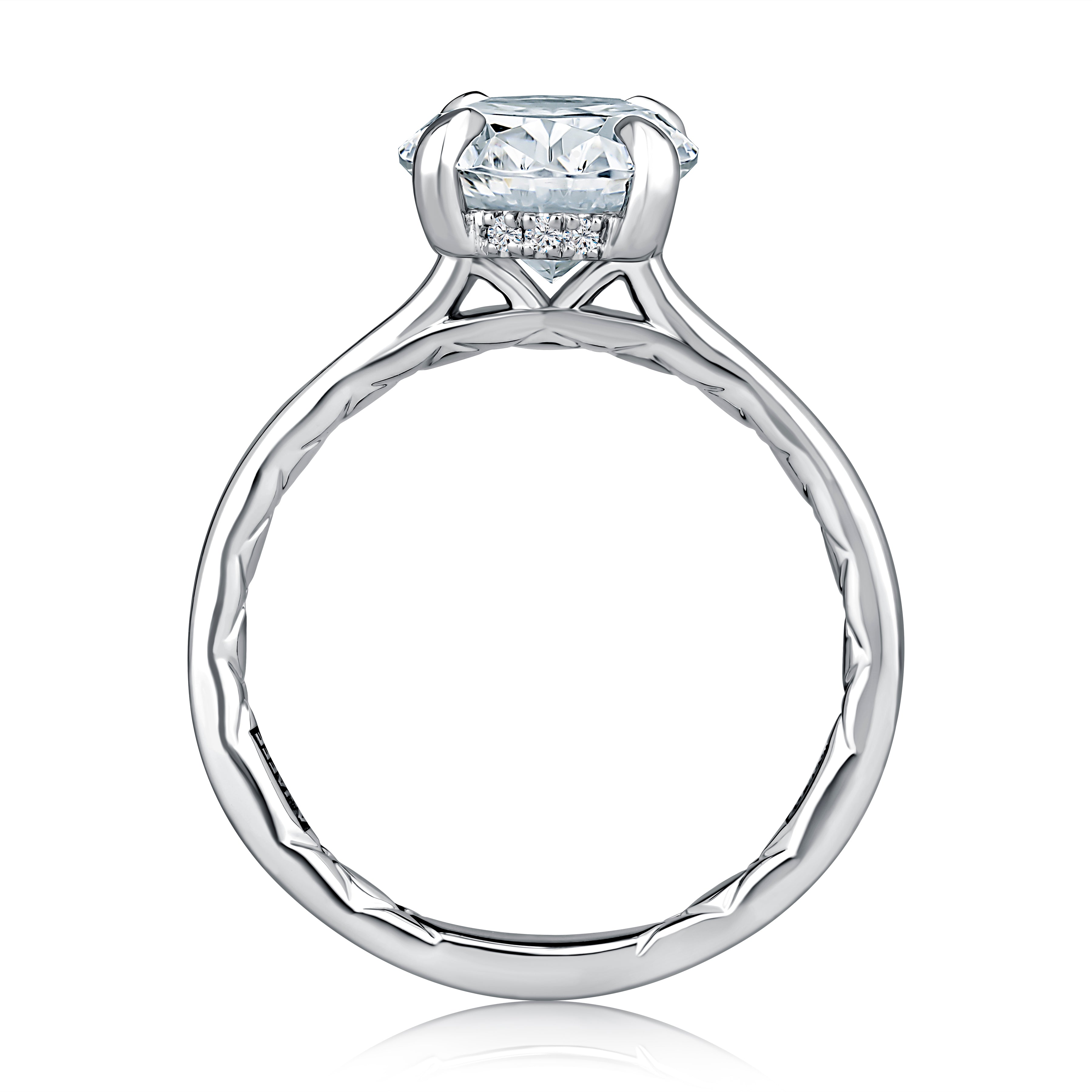 Side view of a 14K white gold engagement ring setting showing the hidden halo of small diamonds beneath the center stone