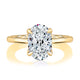 Top view of a 14K yellow gold solitaire engagement ring with an oval center diamond