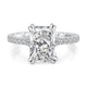 Top view of a 14K white gold engagement ring setting with an elongated radiant center diamond