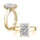 14K yellow gold hidden halo engagement ring setting with an elongated radiant center diamond, shown standing and lying flat
