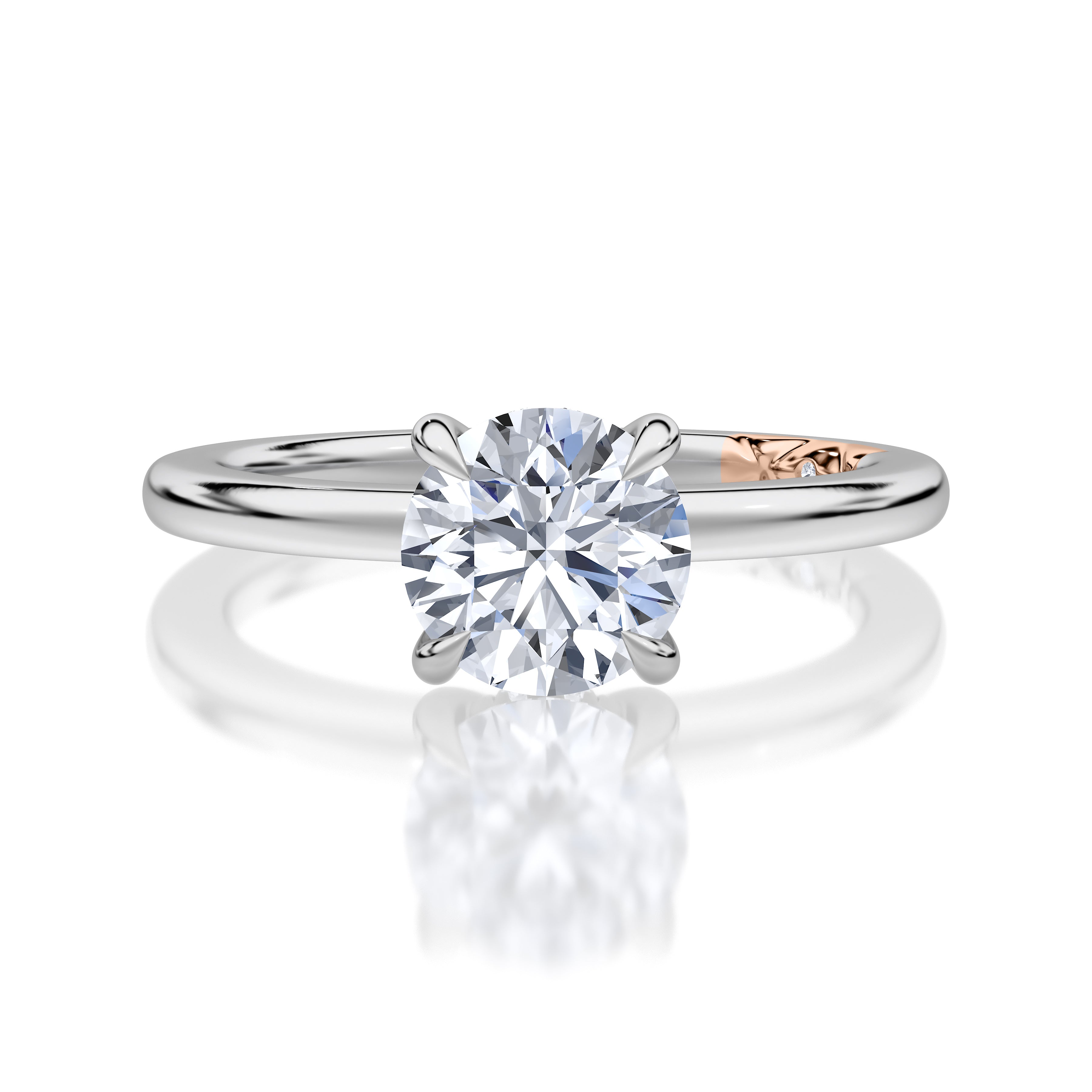 Top view of a 14K white gold four-prong solitaire engagement ring with a round center diamond