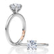 14K white gold four-prong solitaire engagement ring setting with a round center diamond, shown standing and lying flat