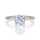 Top view of a 14K white gold four-prong solitaire engagement ring with a round center diamond